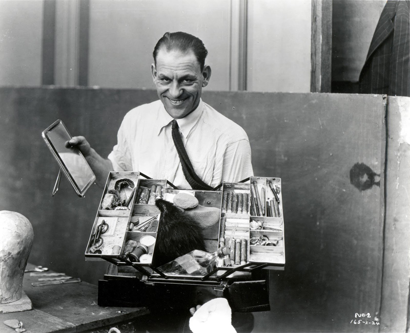 Lon Chaney, star of many 1920s horror movies, and his makeup box, 1925